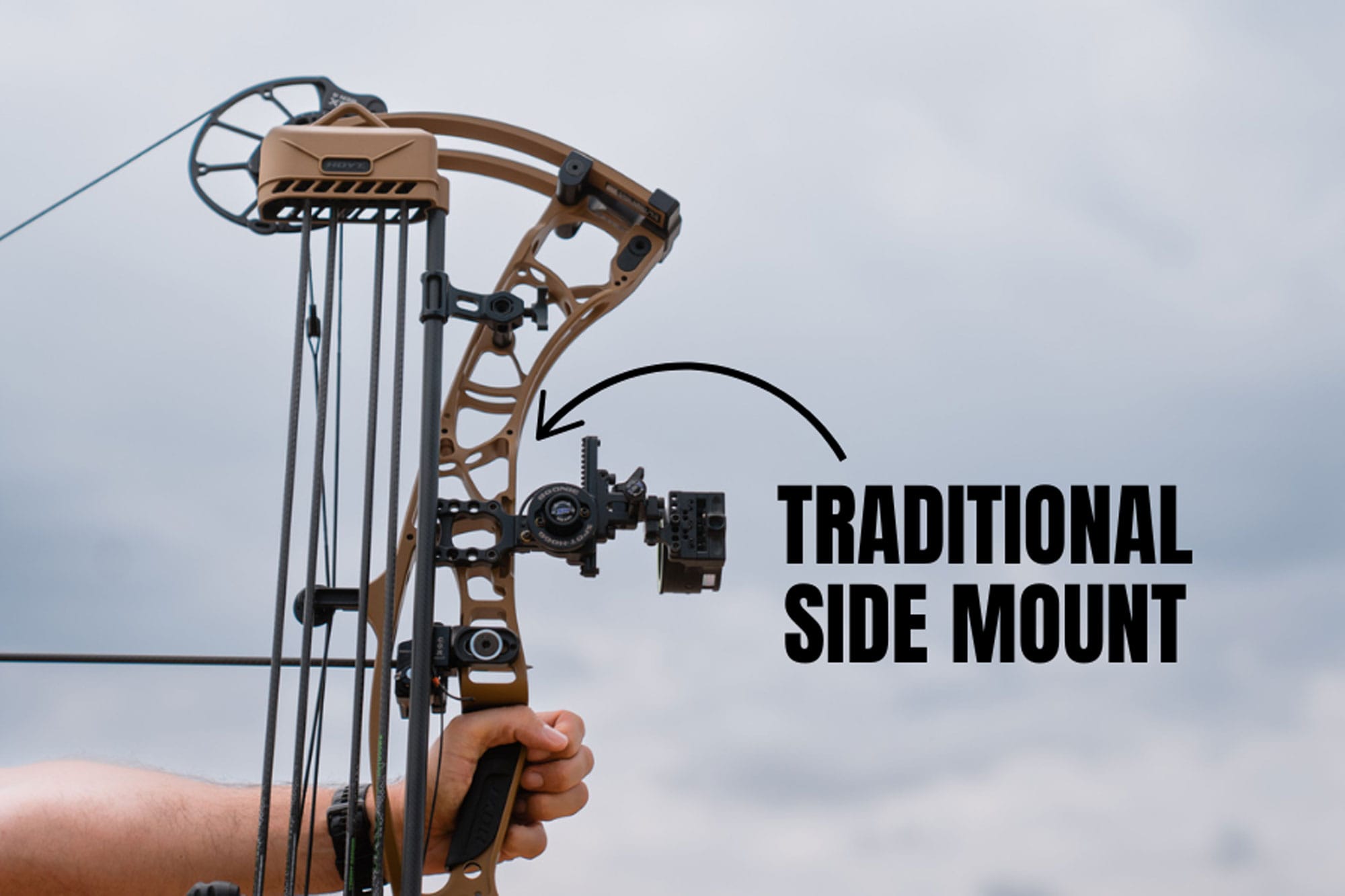 man-holding-a-bow-showing-side-mount Man holding a bow showing side mount