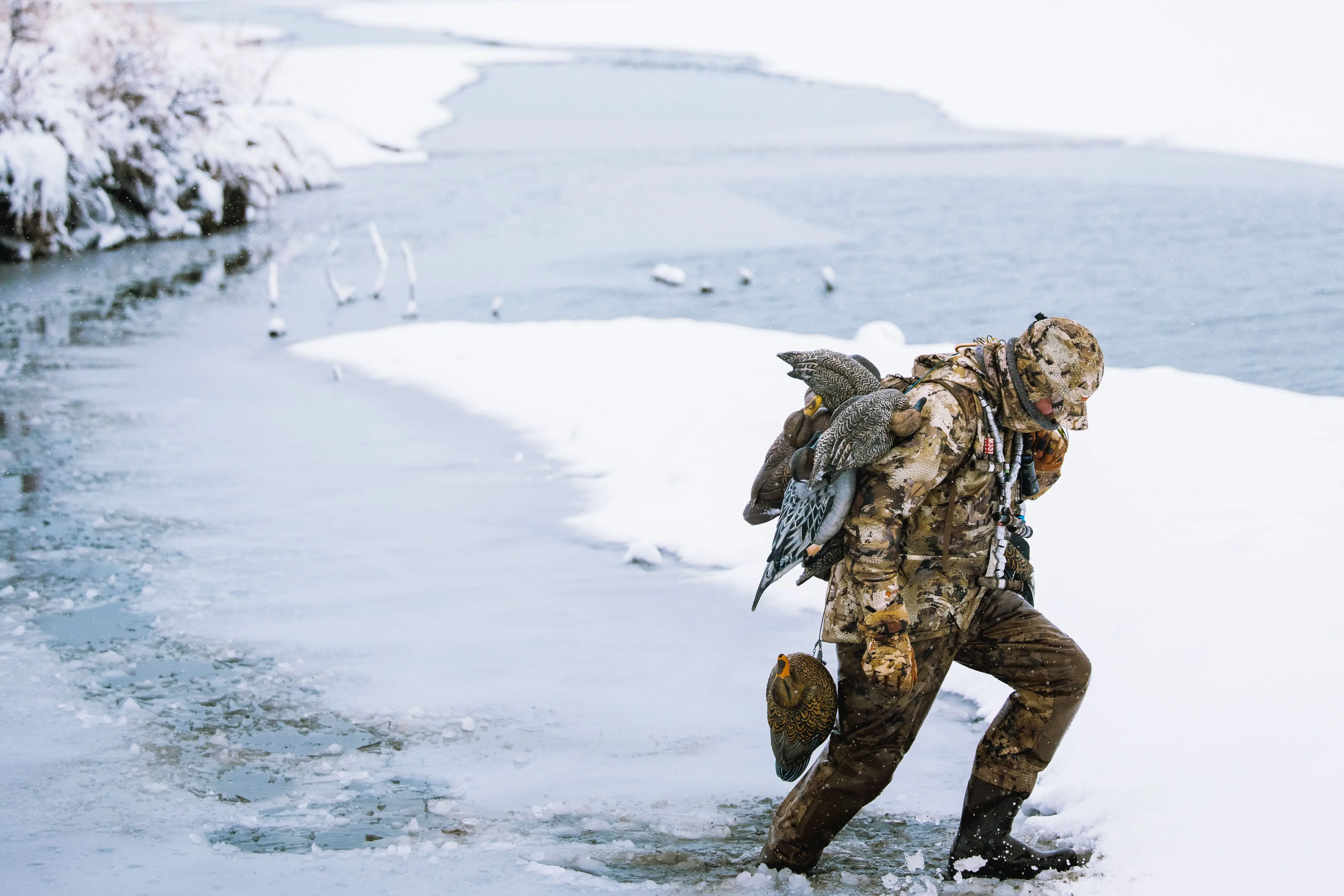 sitka-wader-winter A hunter walking across a frozen stream in the Sitka Delta Pro Waders